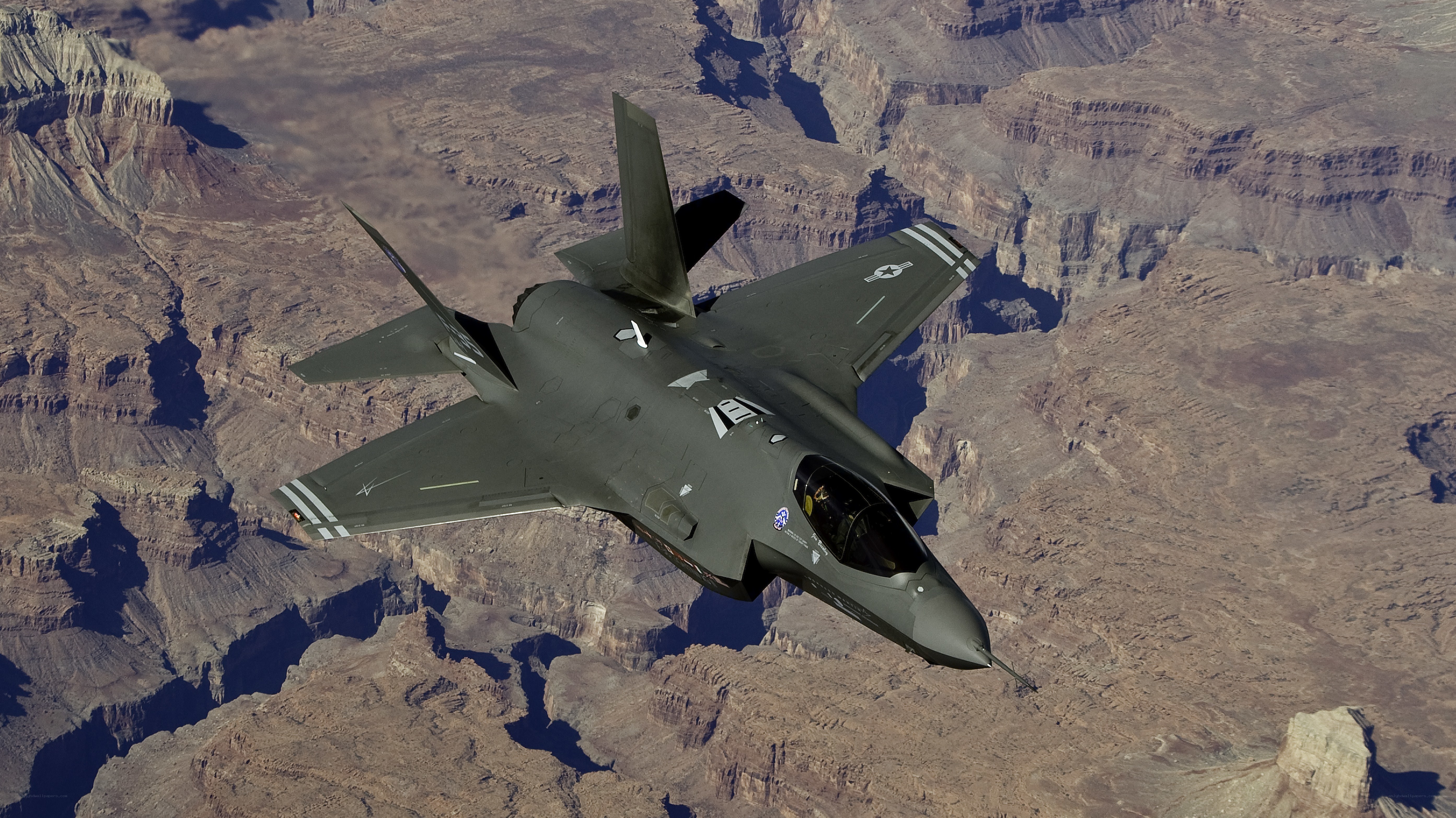 F-35 fighter jet over canyon