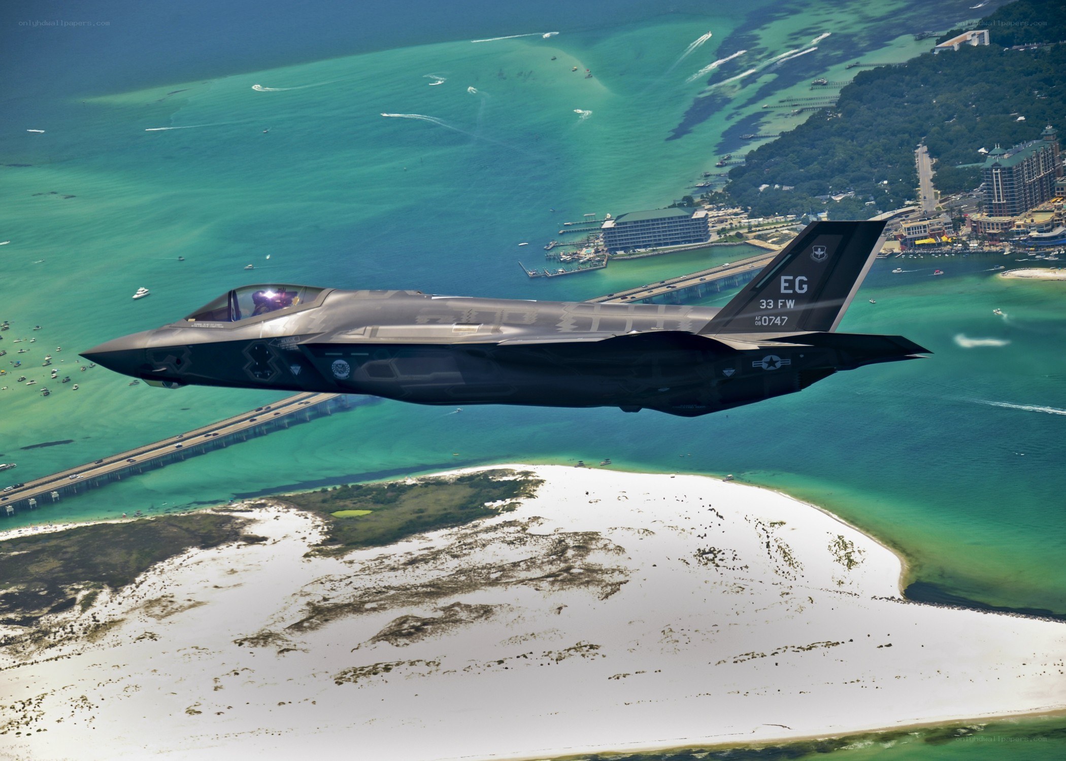 F-35 fighter jet over coastal area