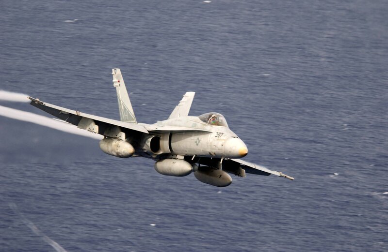 F/A-18 Hornet in flight over ocean