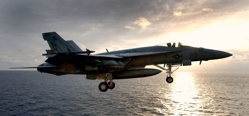 F/A-18 Hornet landing at sunset