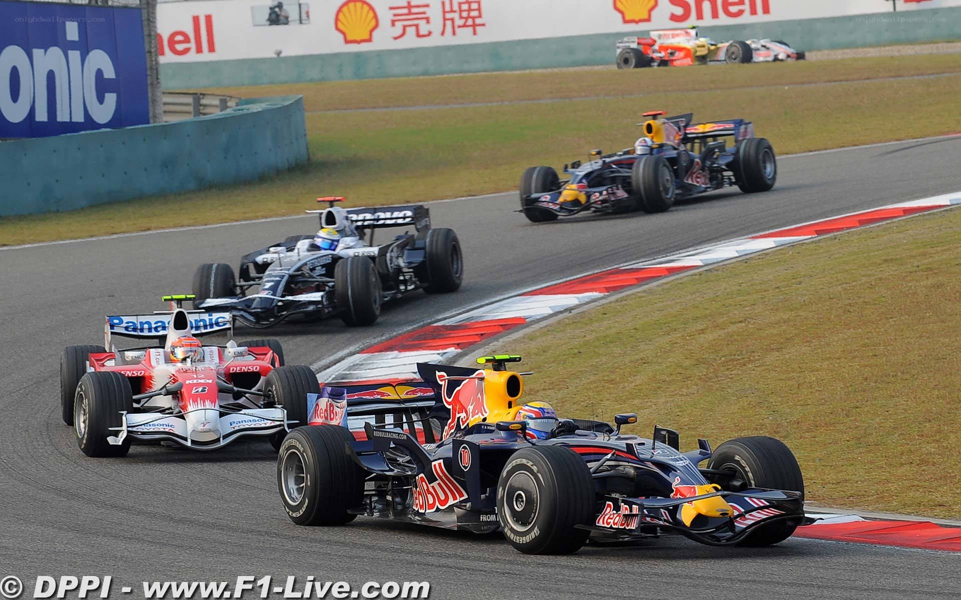 F1 cars racing on track