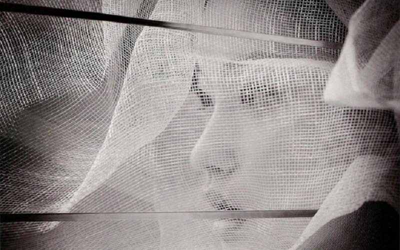Face Behind Mesh Fabric