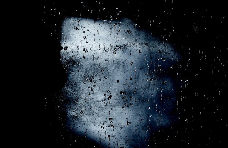 Face Behind Rain-covered Glass — Black