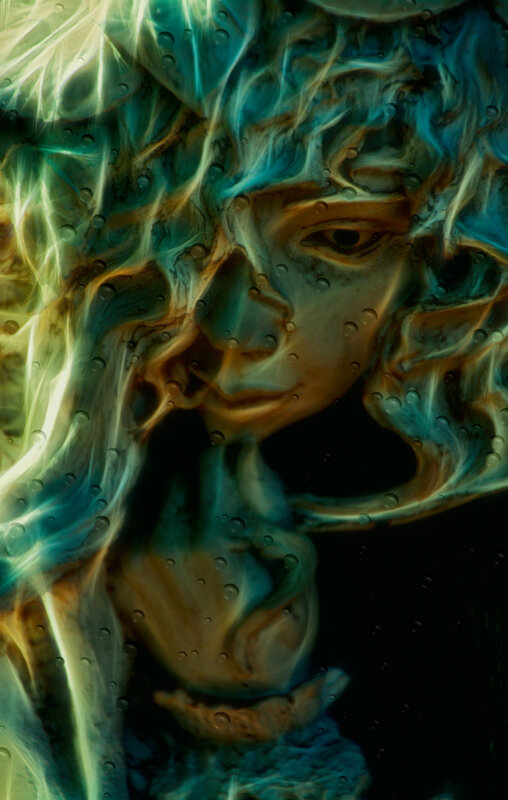 Face in Swirling Colors