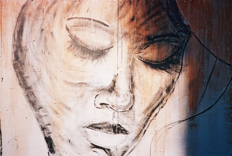 face on wooden surface