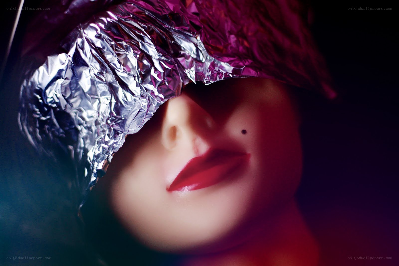 face with foil covering eyes