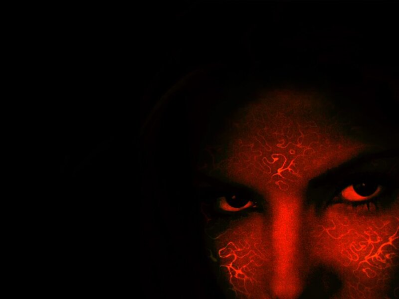 Face with Red Glowing Eyes