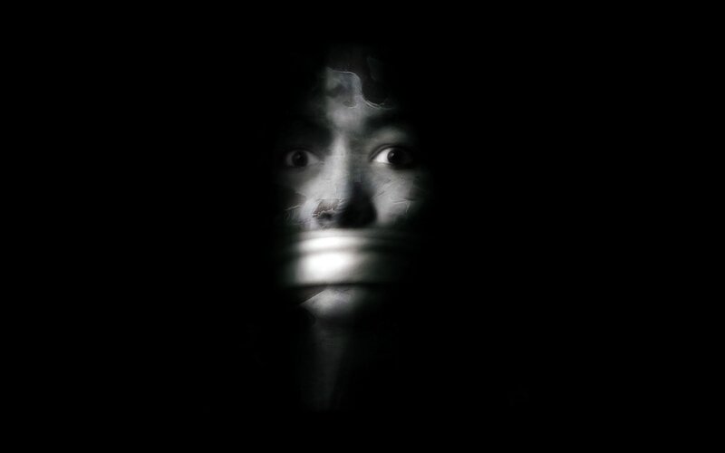 face with tape over mouth