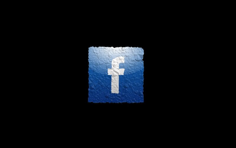 Facebook logo on crumpled paper