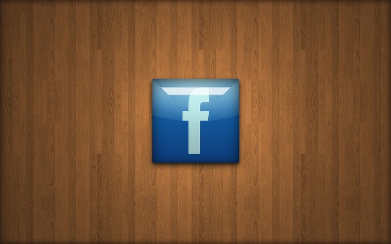 Facebook logo on wood background