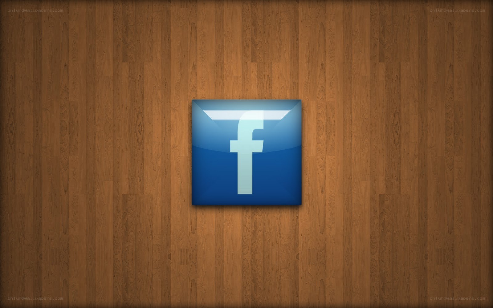 Facebook logo on wood background