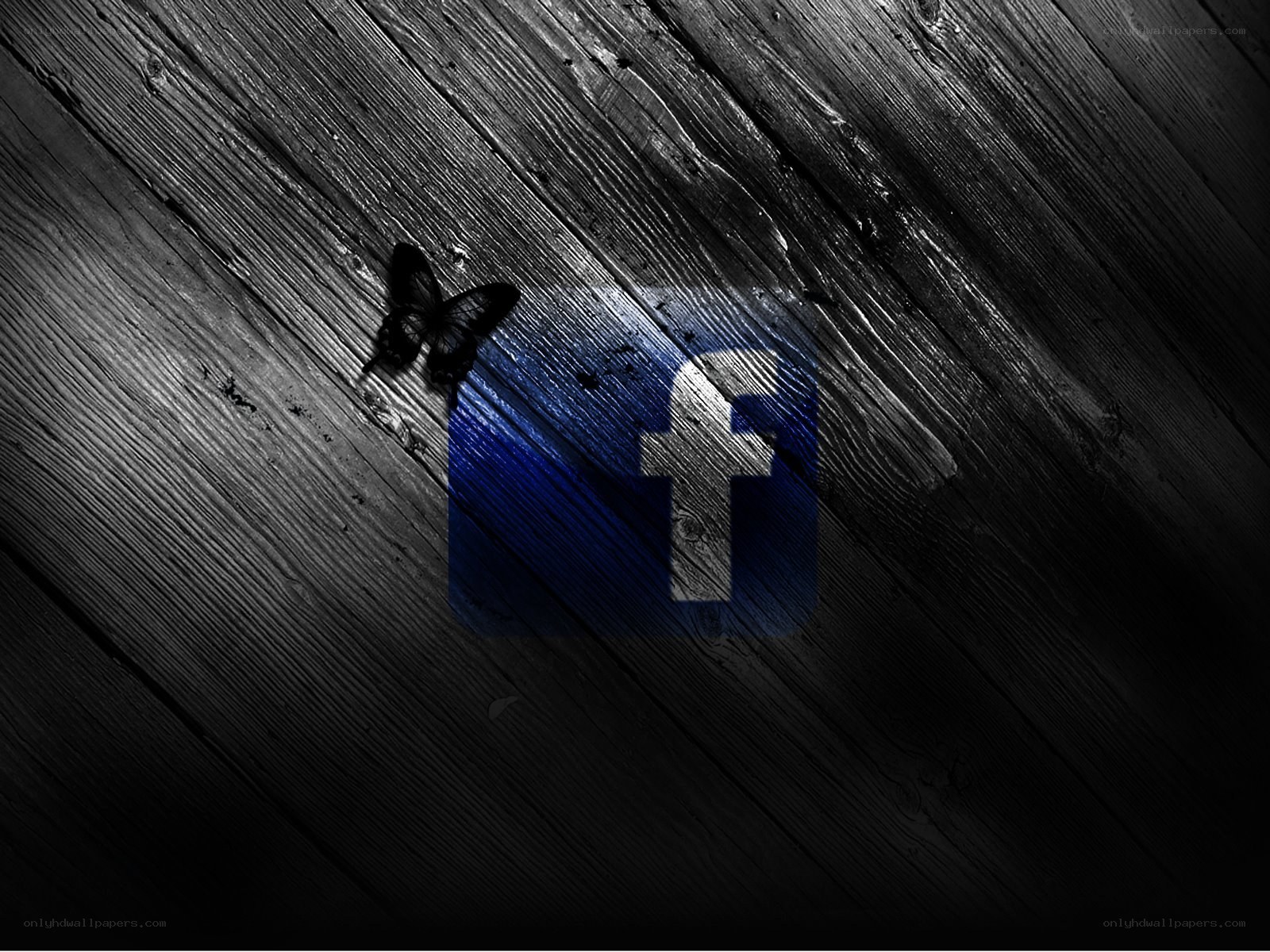 Facebook logo on wood