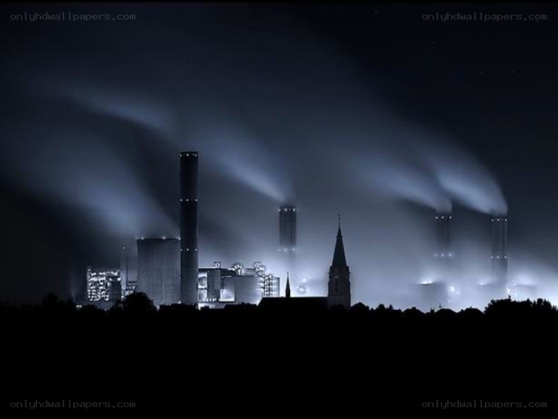 Factory at night with smoke