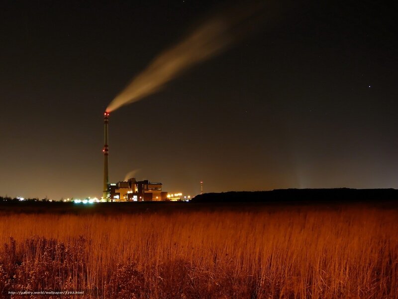 Factory at night with smoke