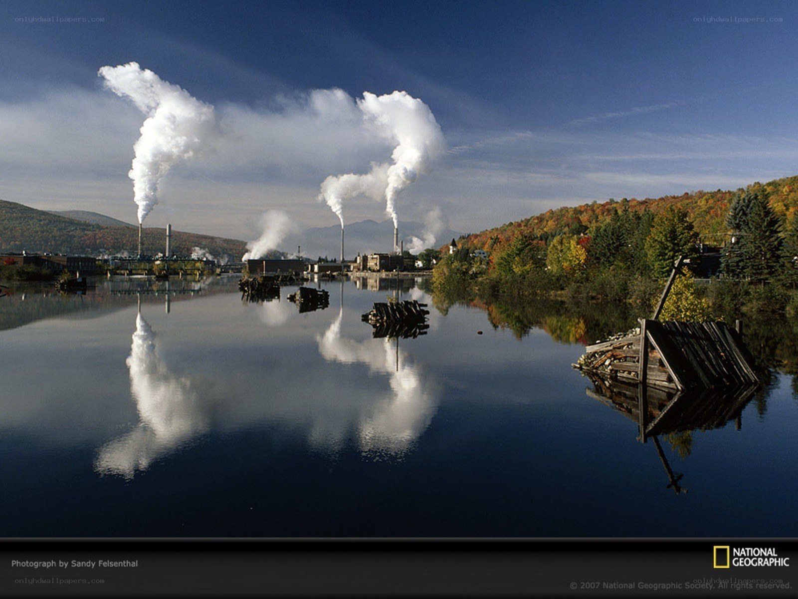 Factory emissions over a river