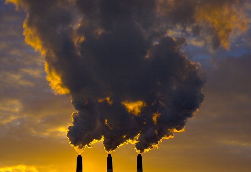Factory smoke at sunset