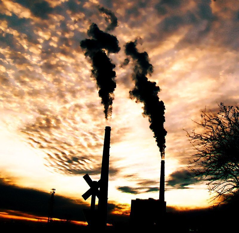 Factory smoke at sunset