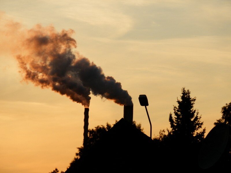 Factory smoke at sunset