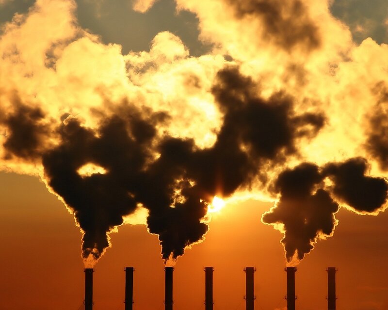 Factory smoke at sunset