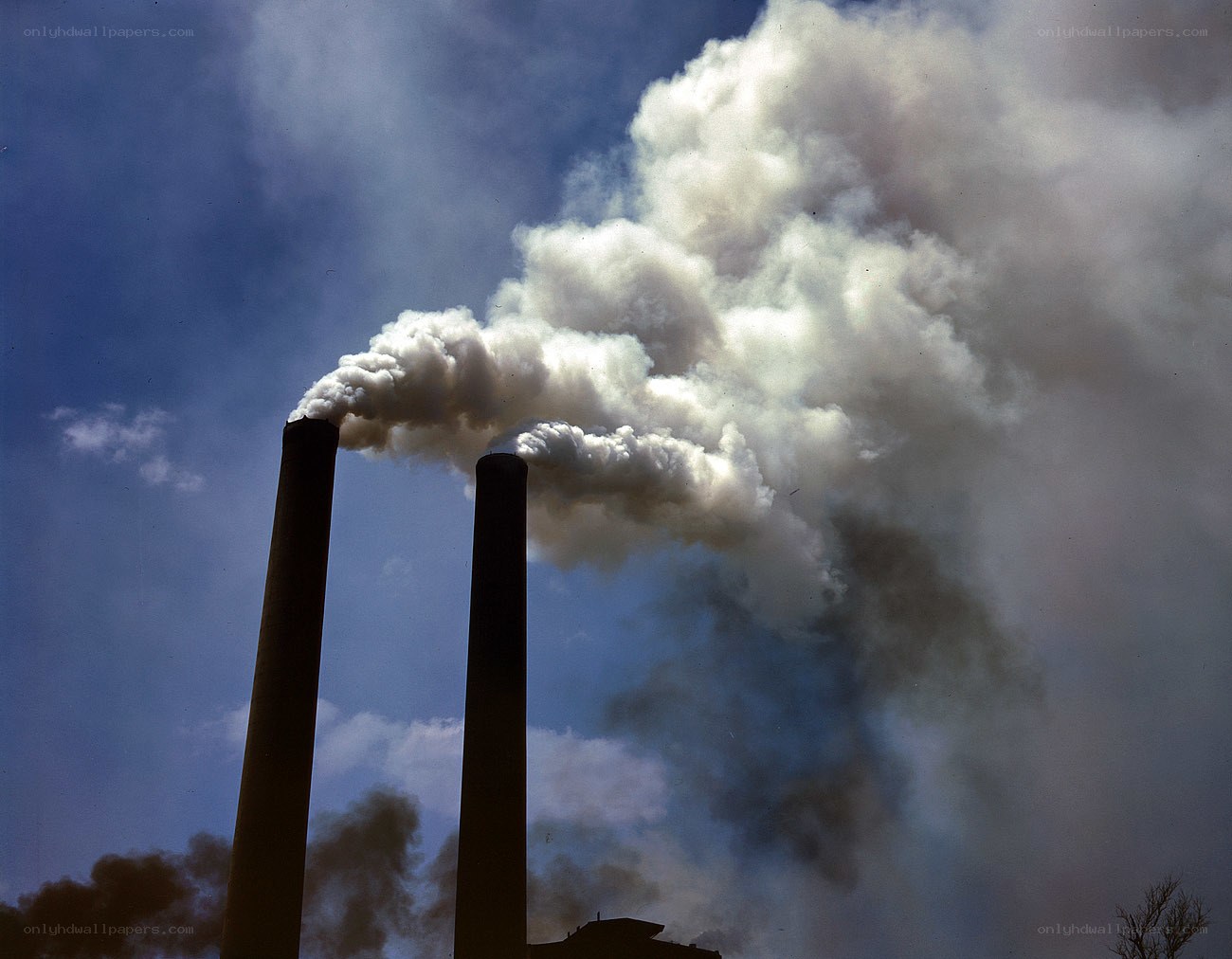 Factory smokestacks emitting pollution