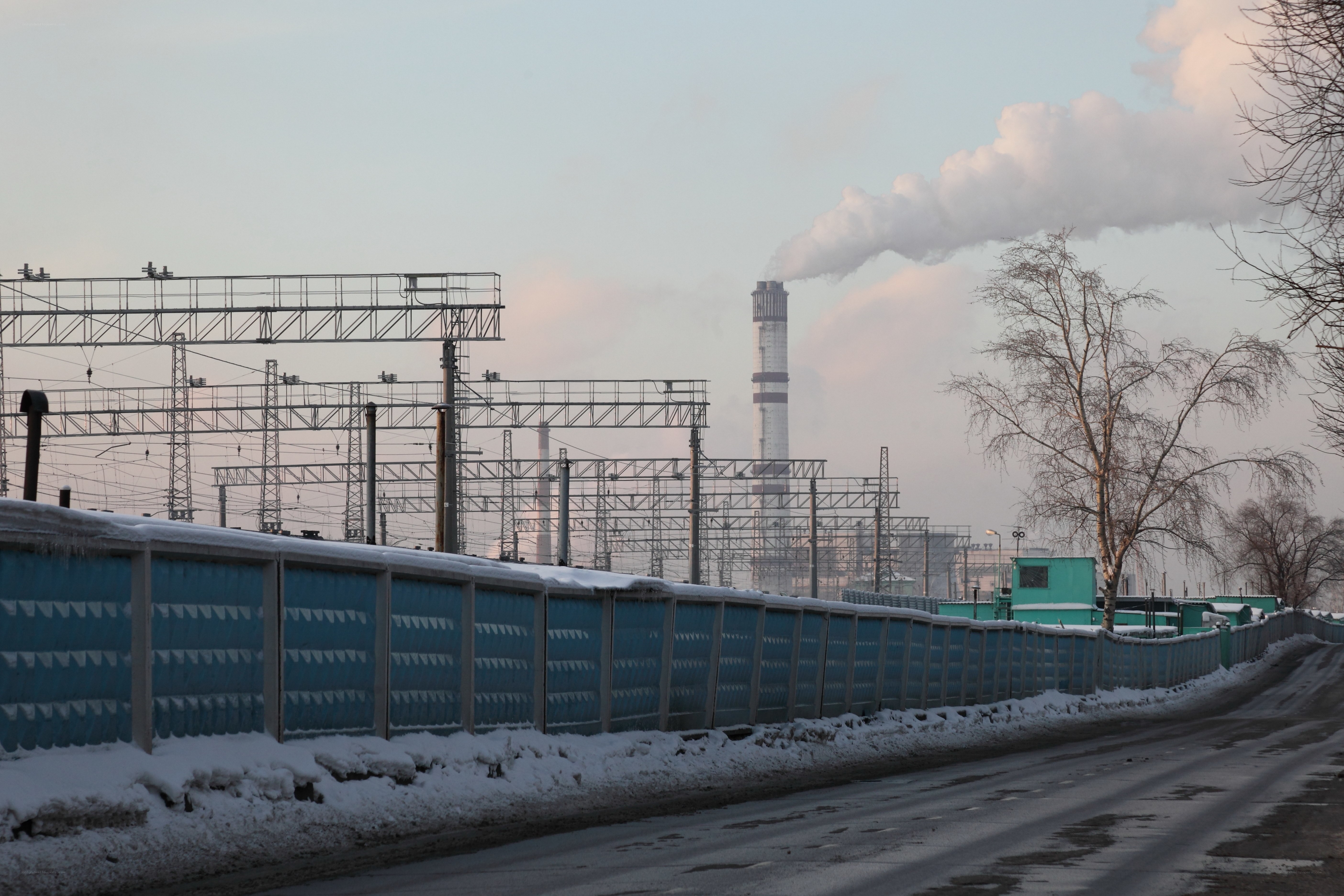 Factory with smokestack in winter