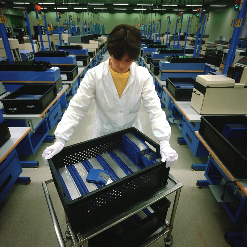 Factory worker handling components