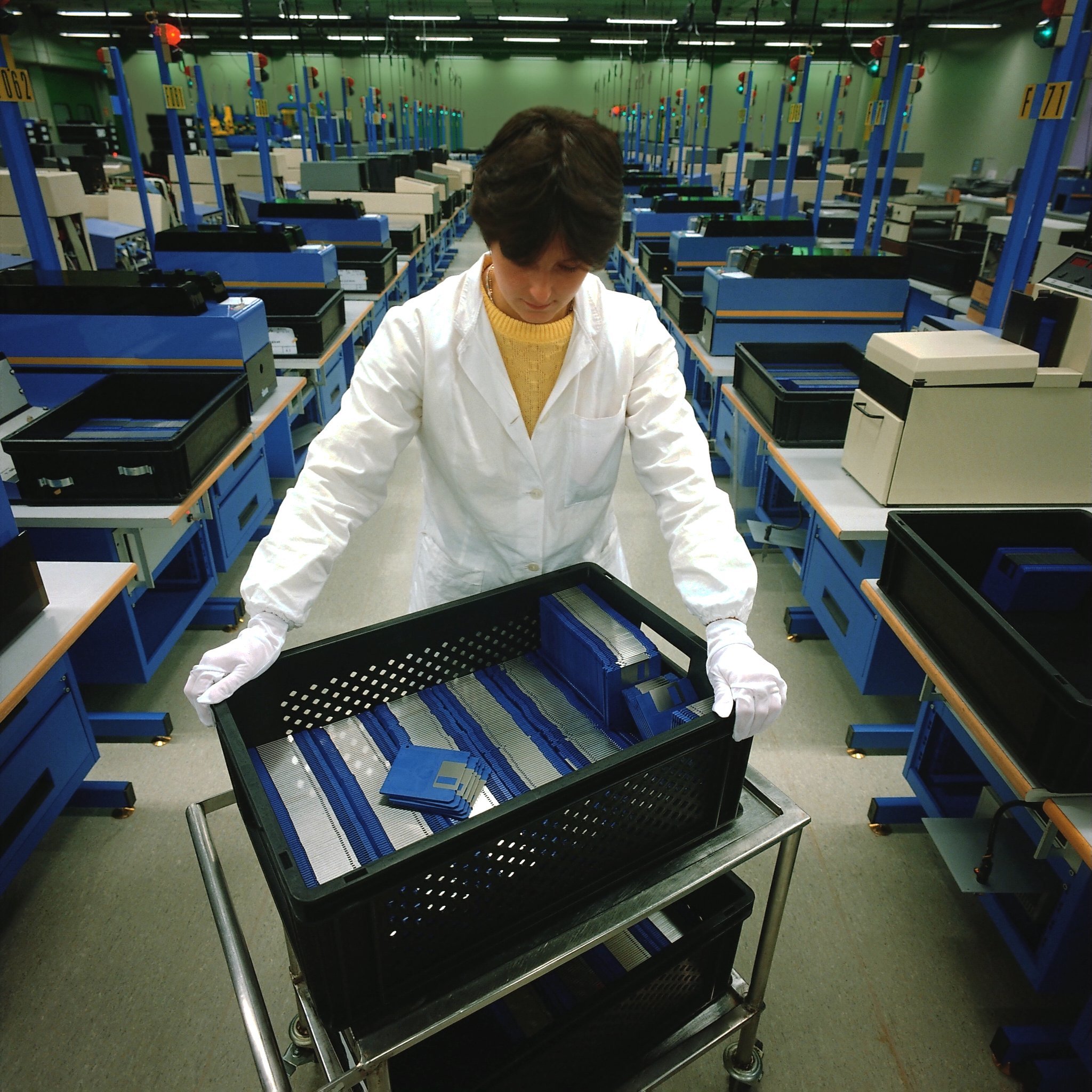 Factory worker handling components