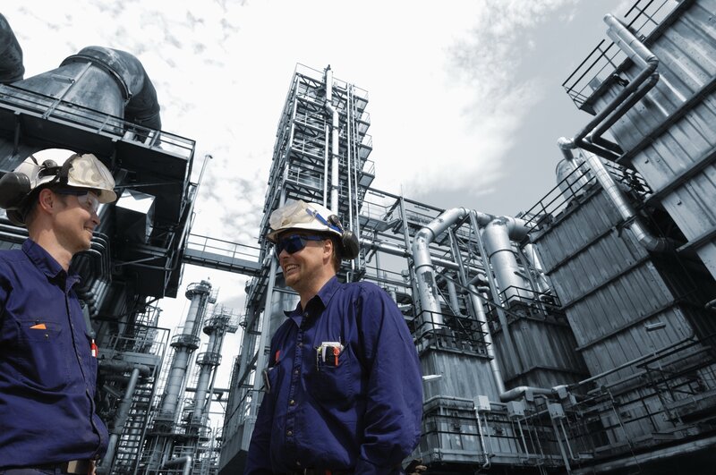 Factory workers in conversation