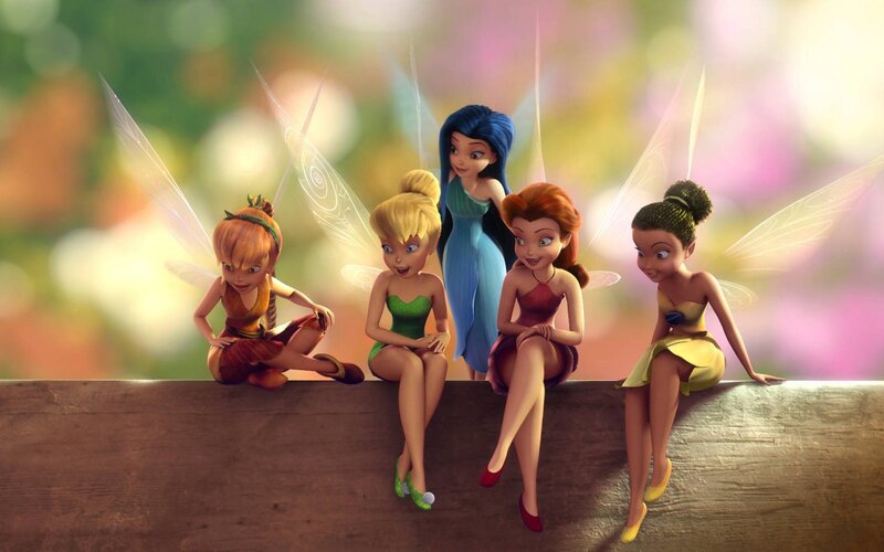 fairies sitting on a log