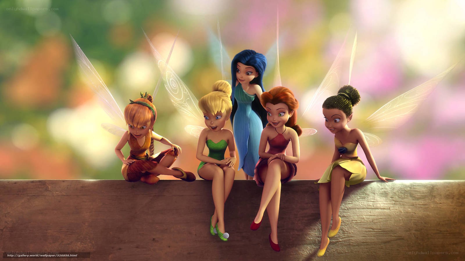 fairies sitting on a log