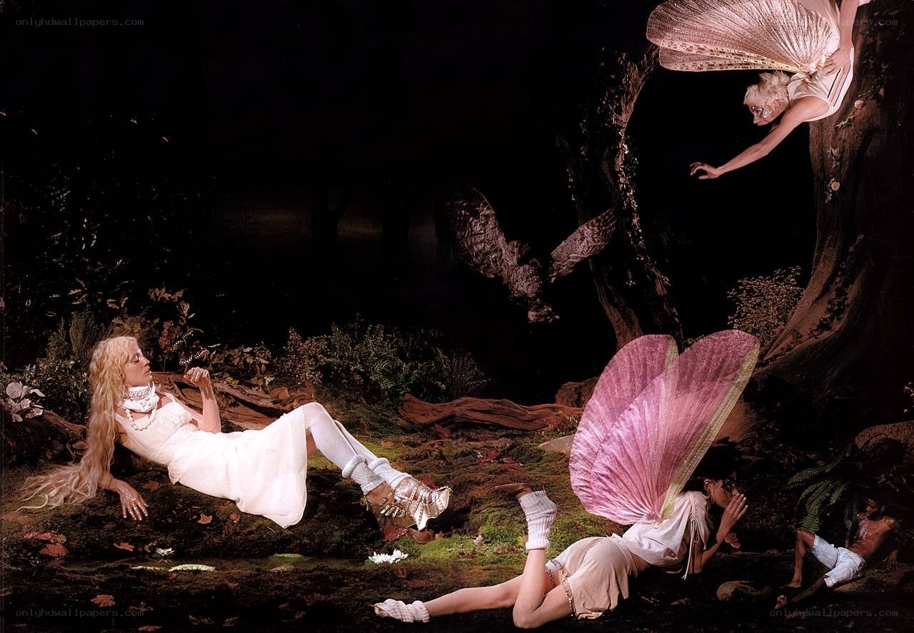 Fairy figures in a dark forest