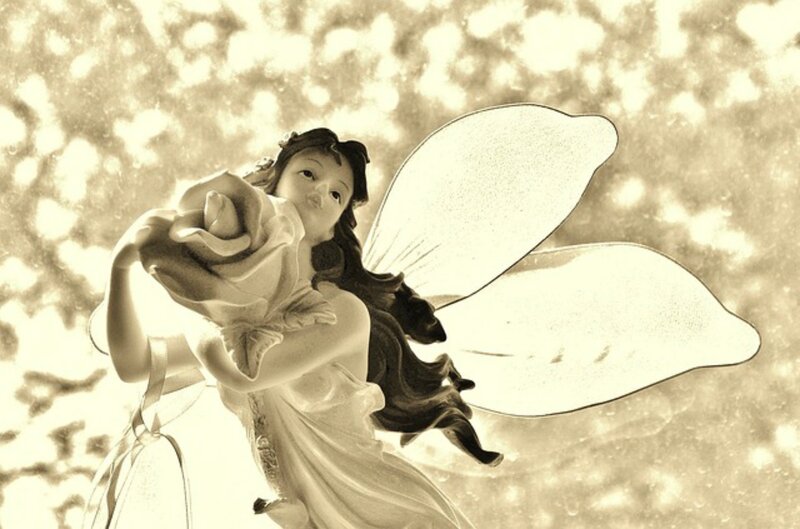 Fairy Figurine Holding Rose