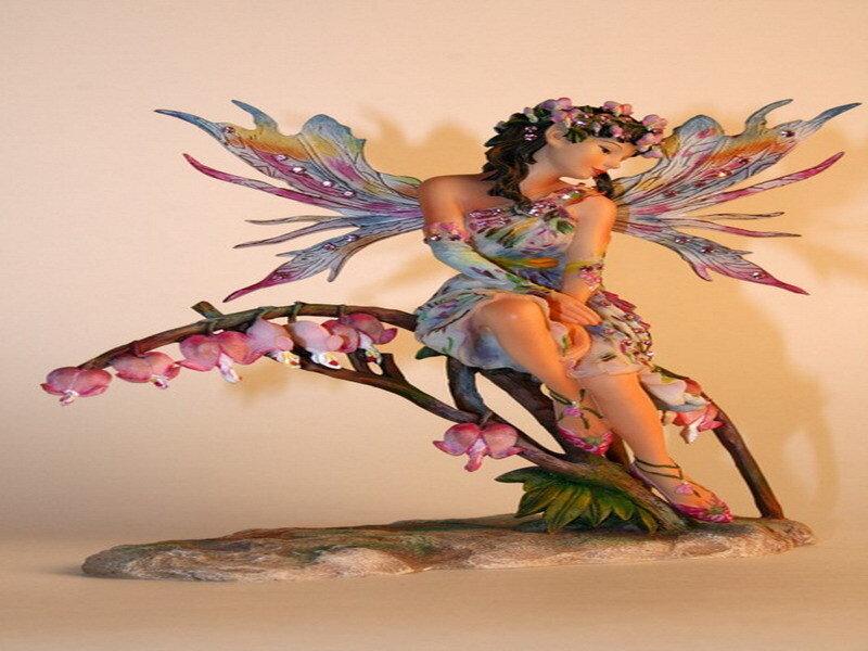 fairy figurine on branch