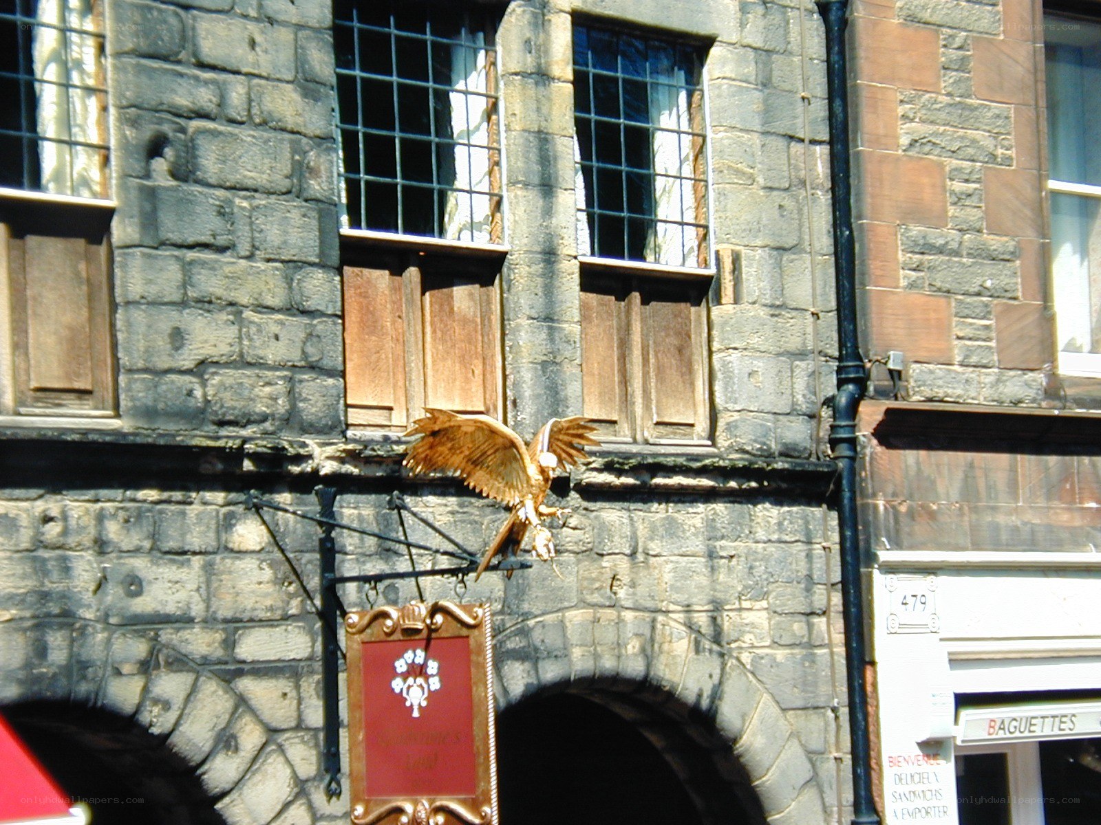 Falcon sculpture on stone building