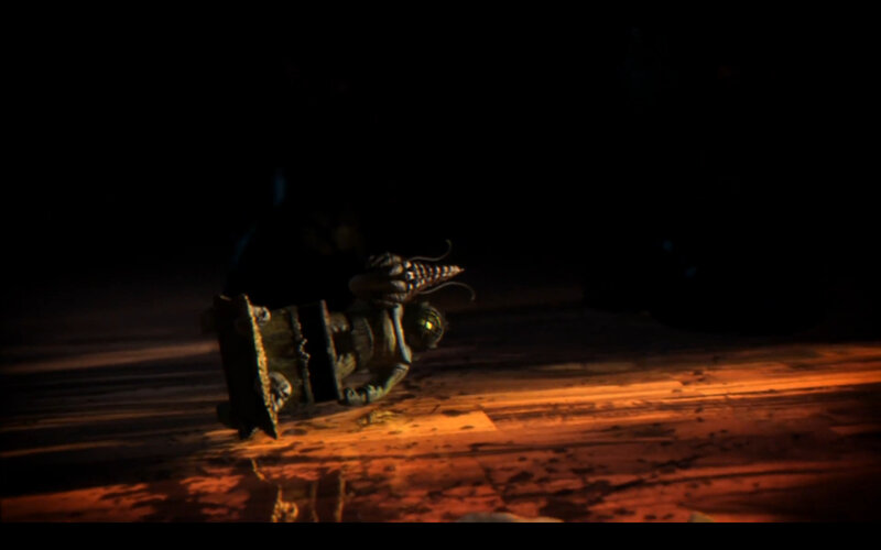 fallen robot in dark room