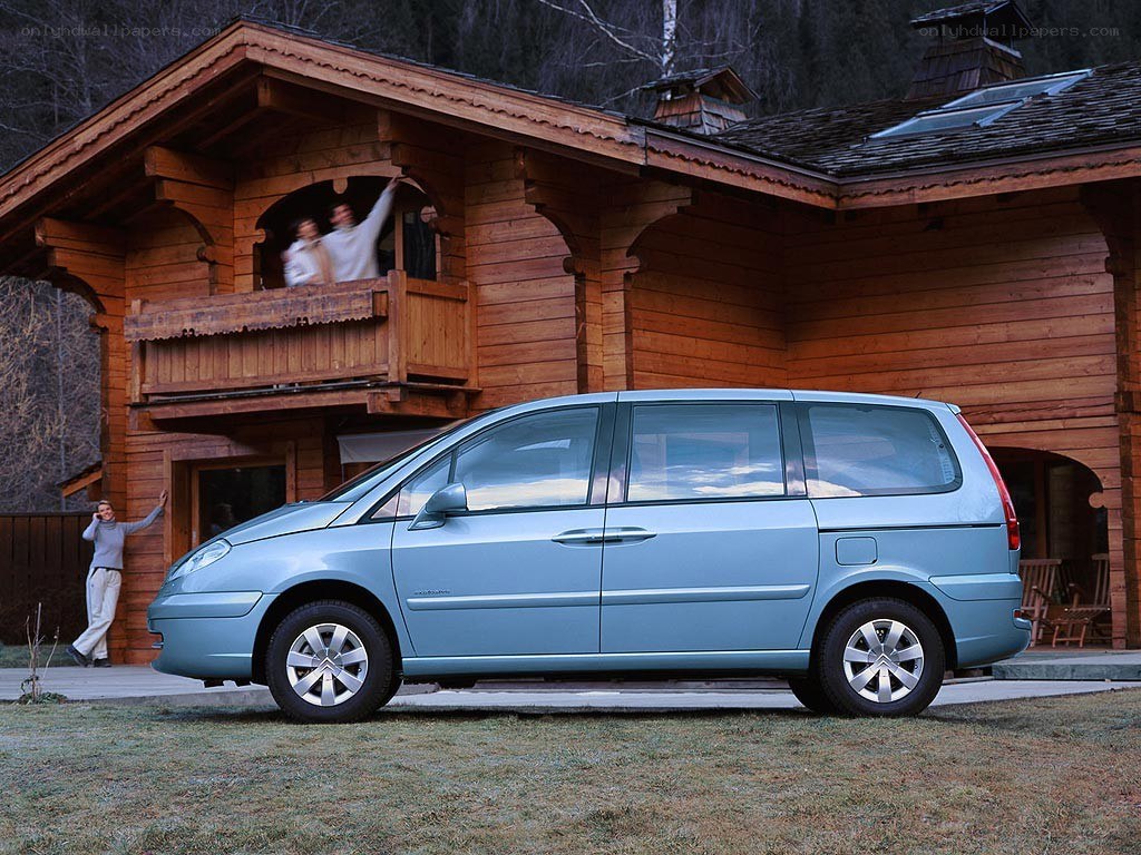 Family at chalet with minivan