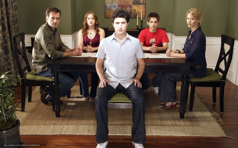 Family at Dining Table — Green, Serious