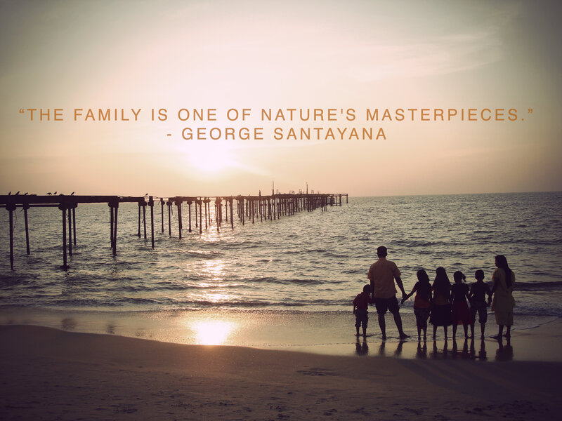 Family at sunset on the beach