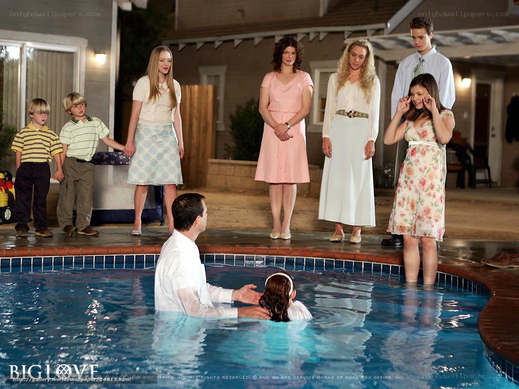 Family baptism by pool