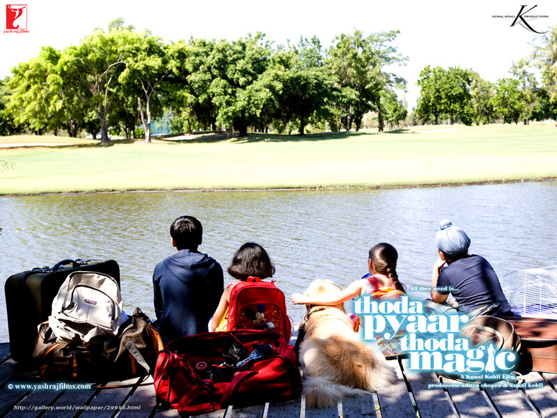 Family by the lake with dog