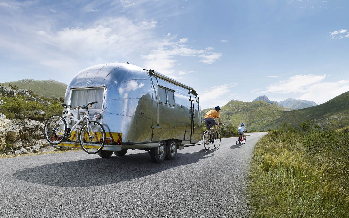 Family cycling with trailer
