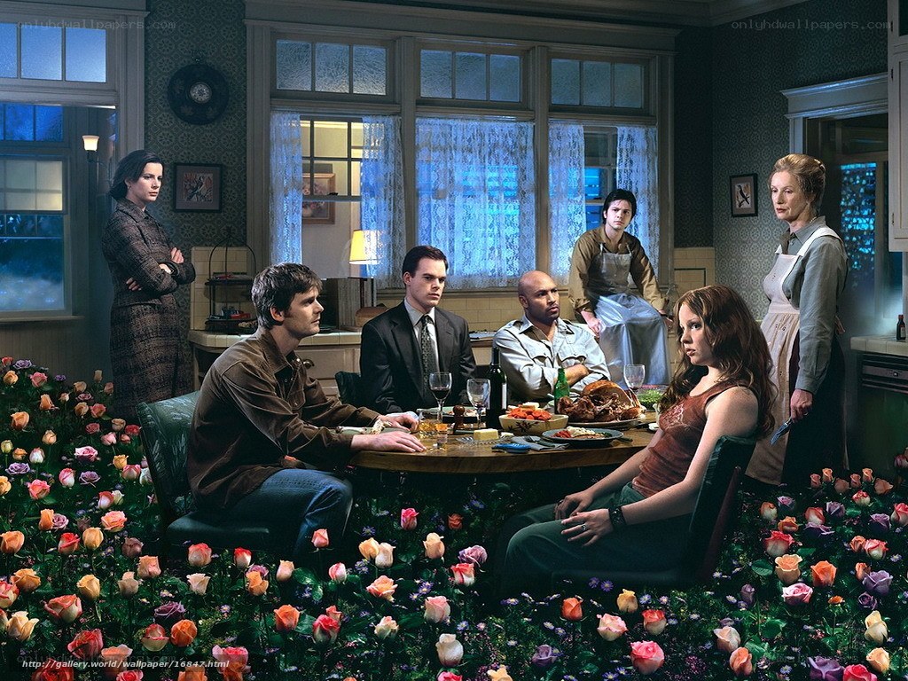 Family dinner in a flower-filled room