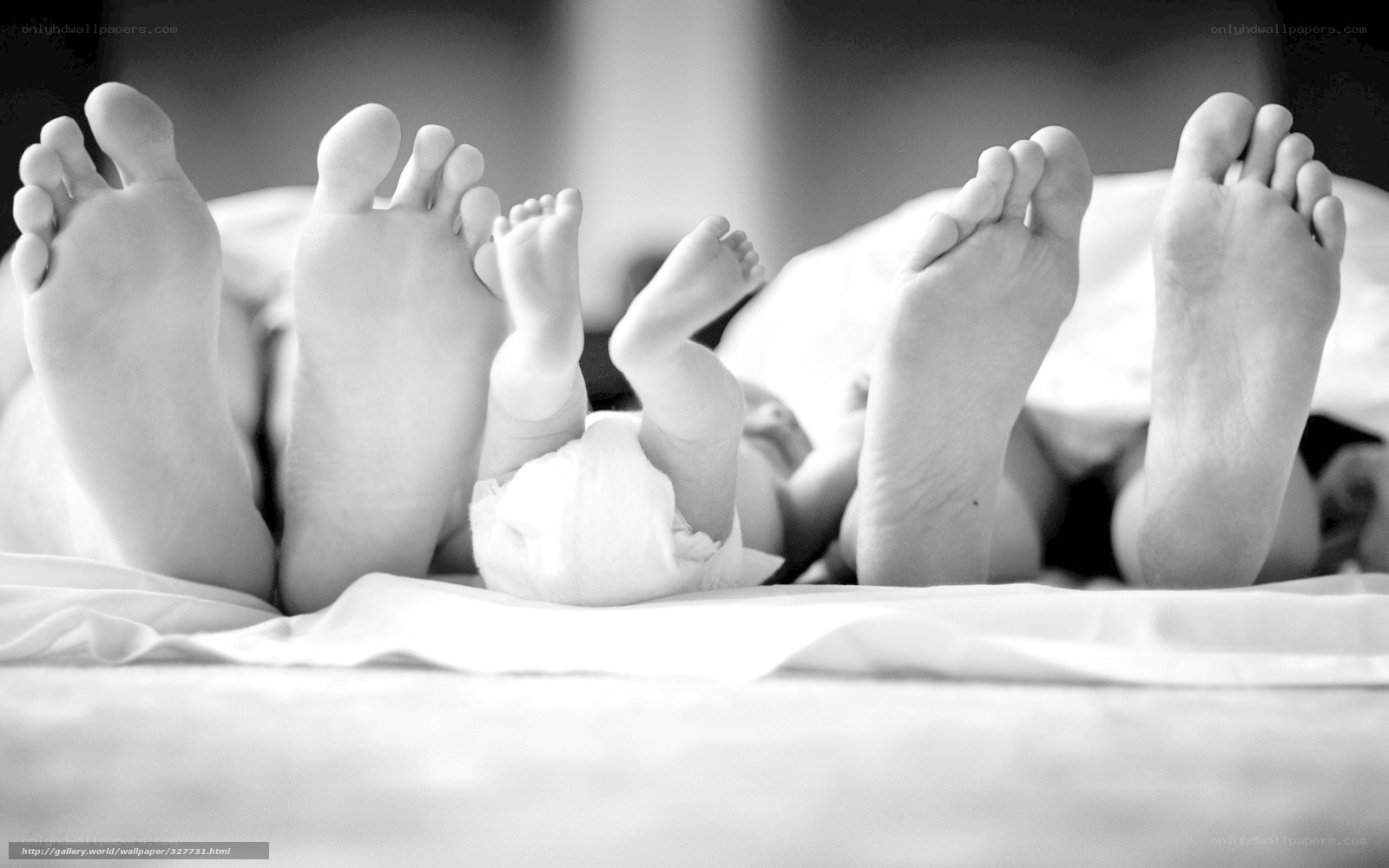 family feet on bed