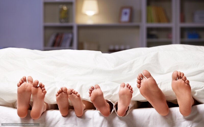 family feet under blanket
