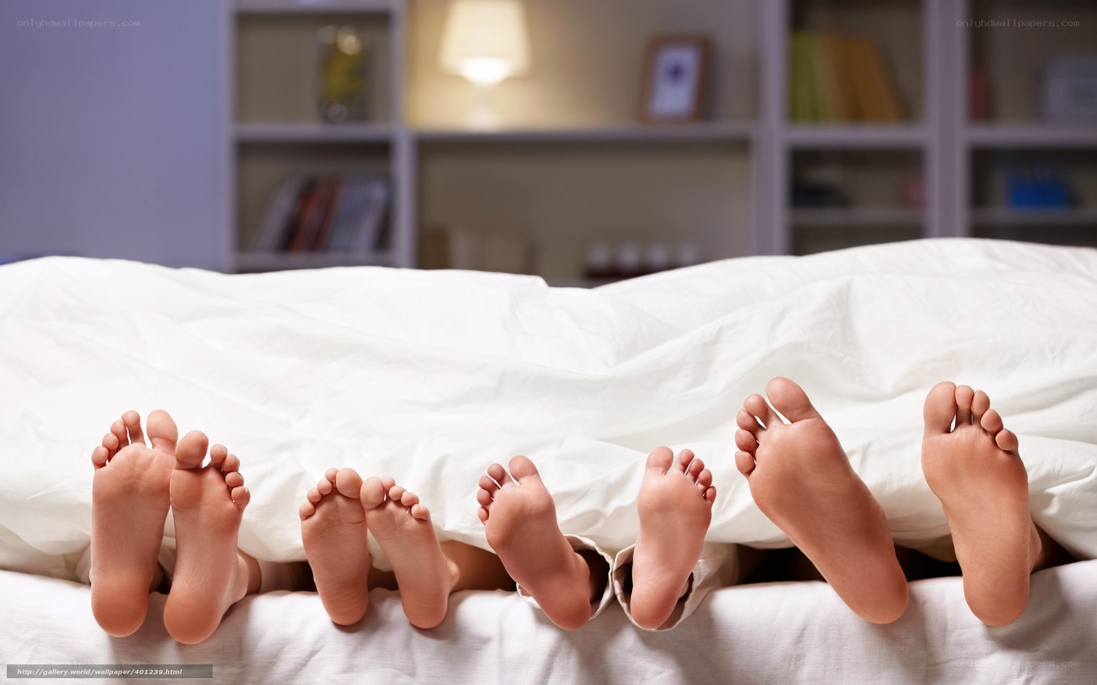 family feet under blanket