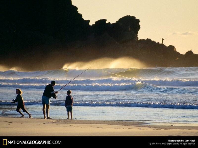 Family fishing at sunset