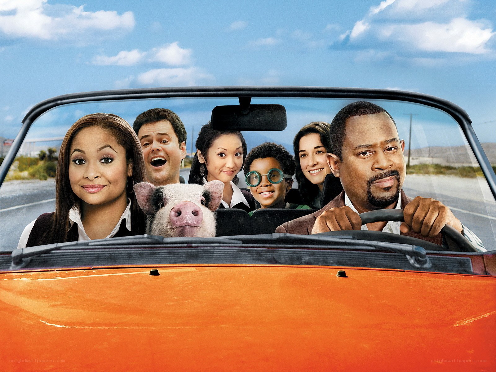 Family in a convertible car