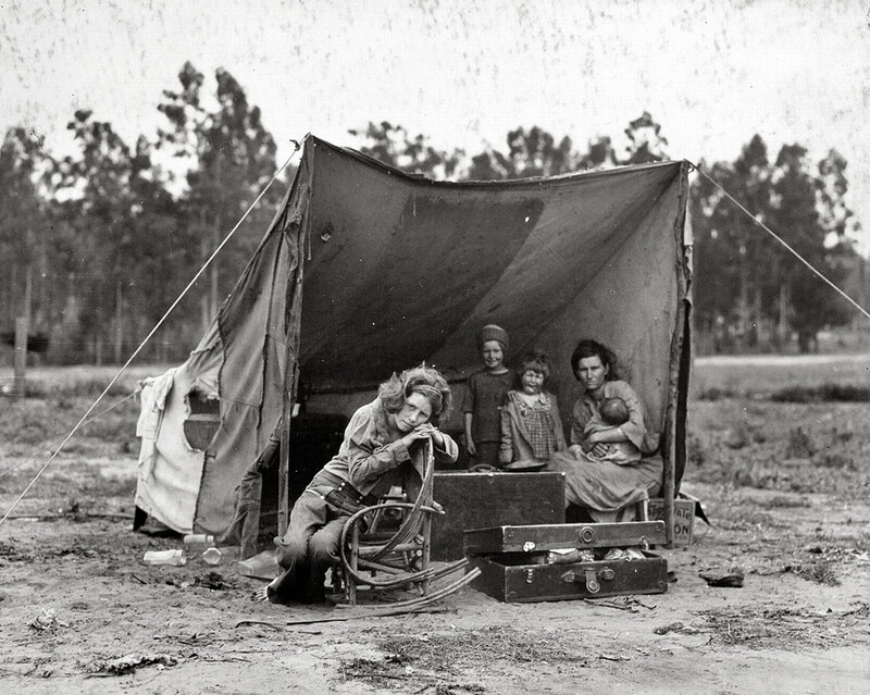 Family in a makeshift tent