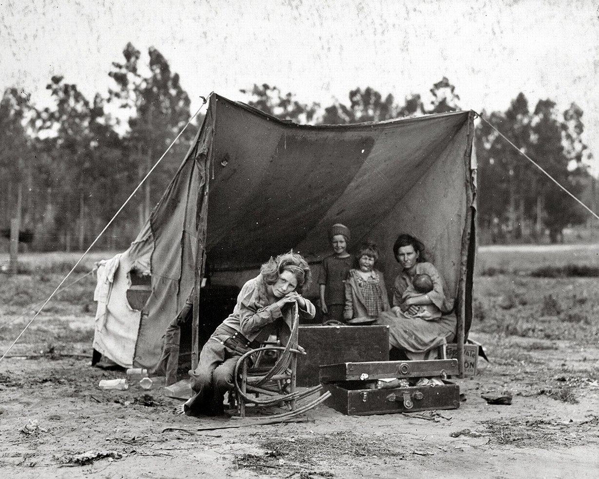 Family in a makeshift tent