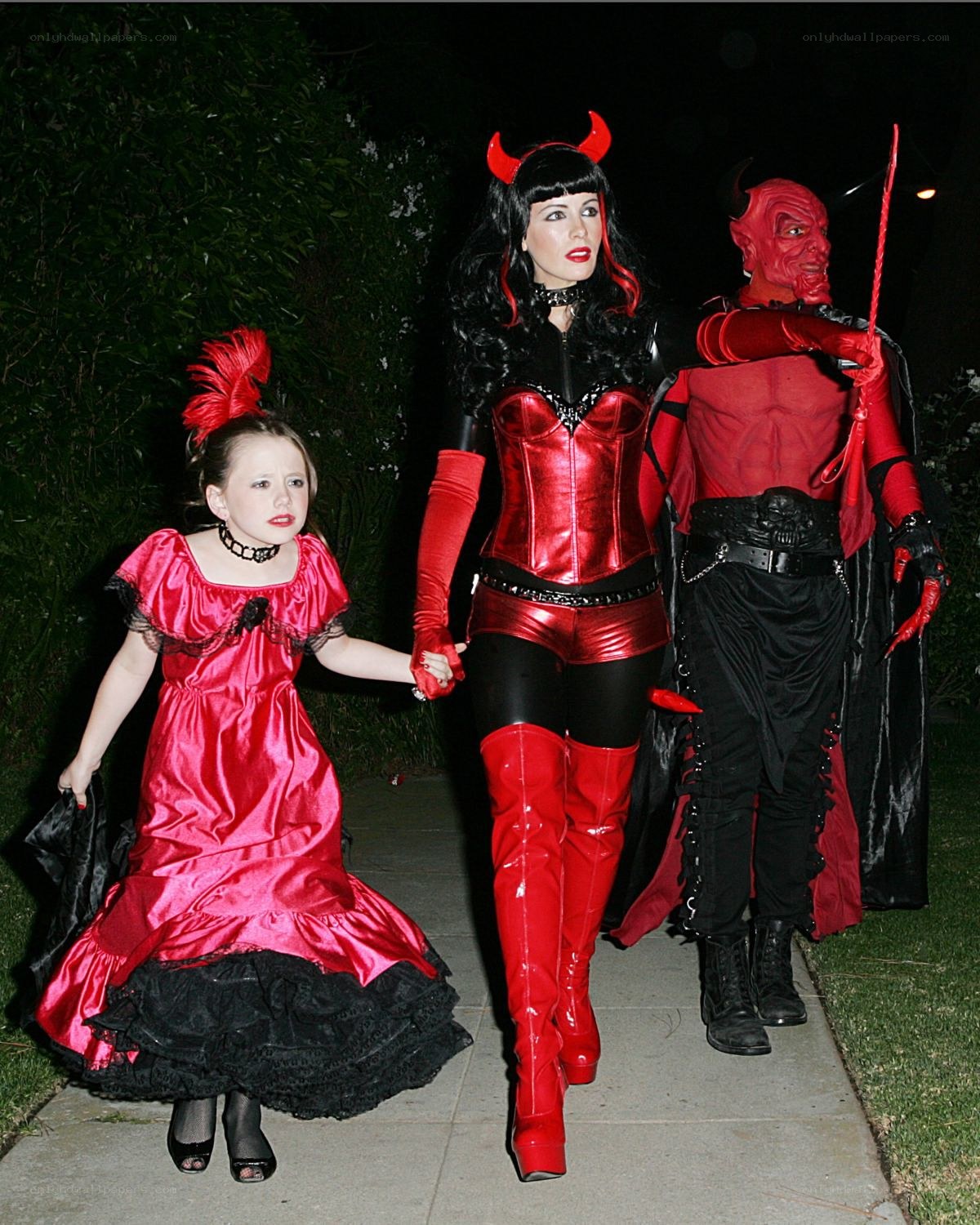 Family in devil costumes